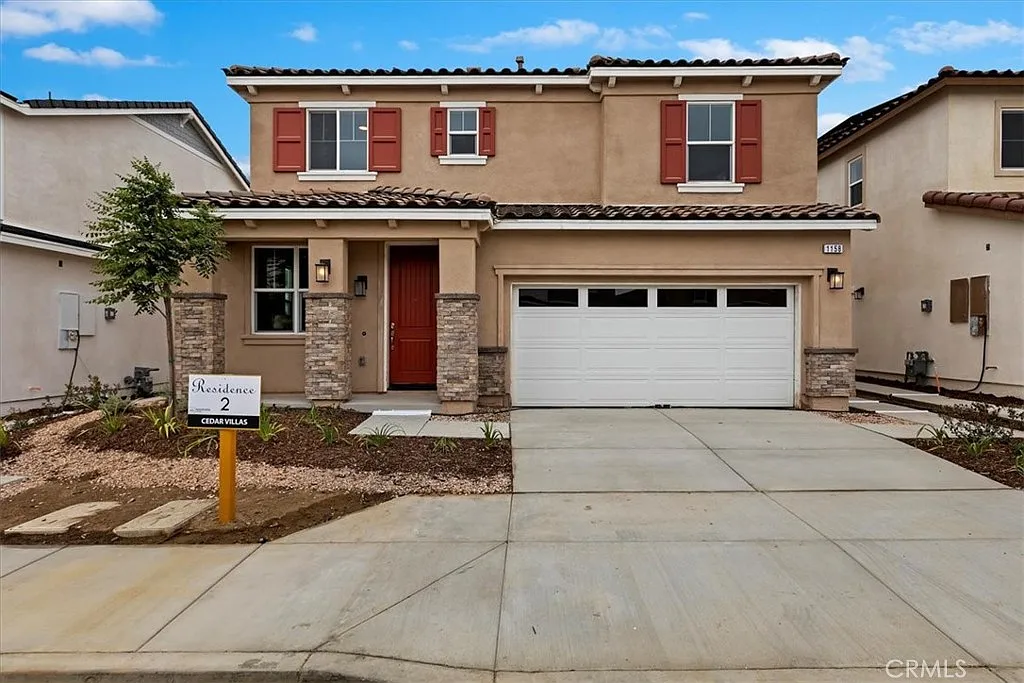 Two-story house real estate with beige walls, red shutters, garage, driveway, and Residence 2 sign.