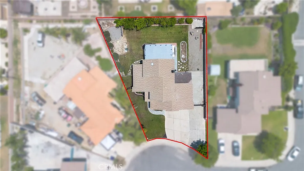 Aerial view of property with swimming pool outlined in red, real estate.
