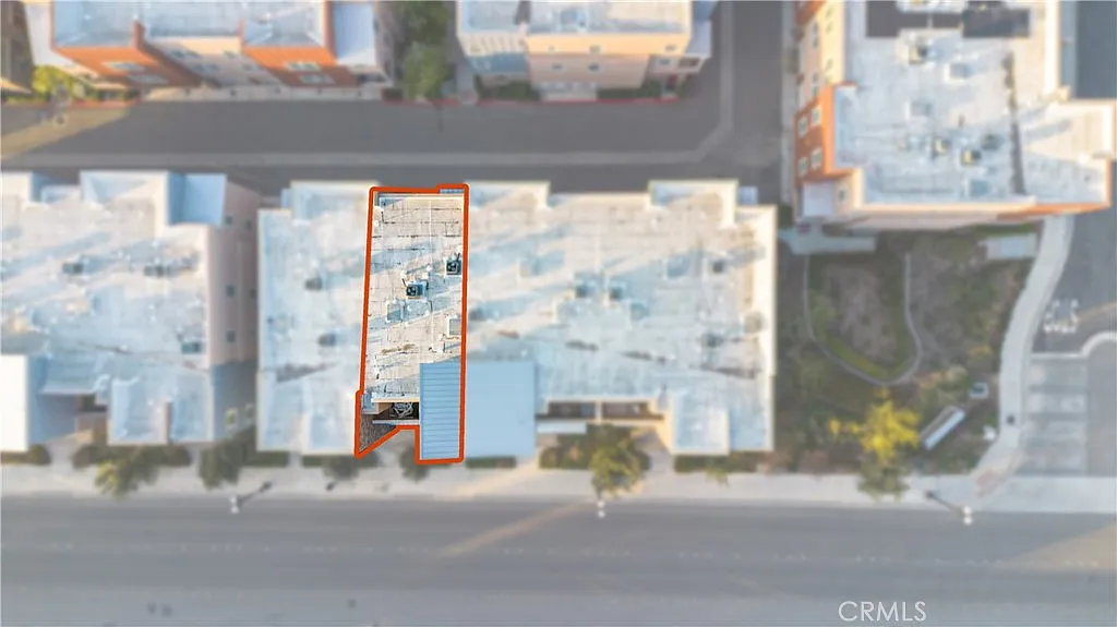 Aerial view of building complex with section highlighted.