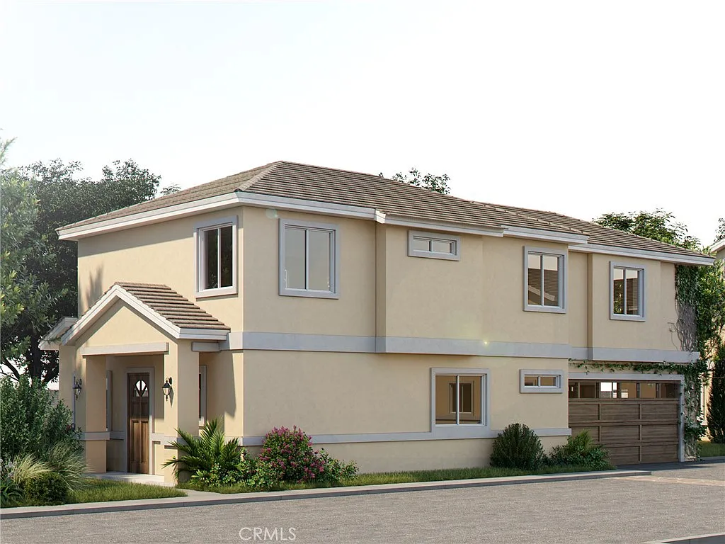 Two-story house California real estate with beige walls, brown roof, garage, and yard.
