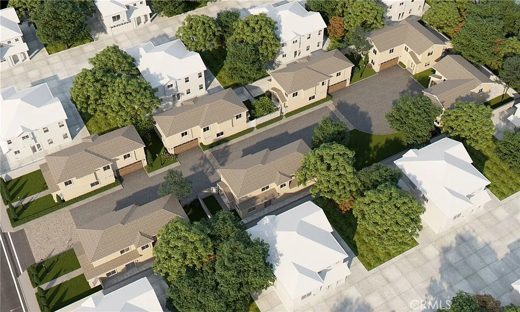 Aerial view of a neighborhood with houses, tree-lined streets, and green areas, California real estate.